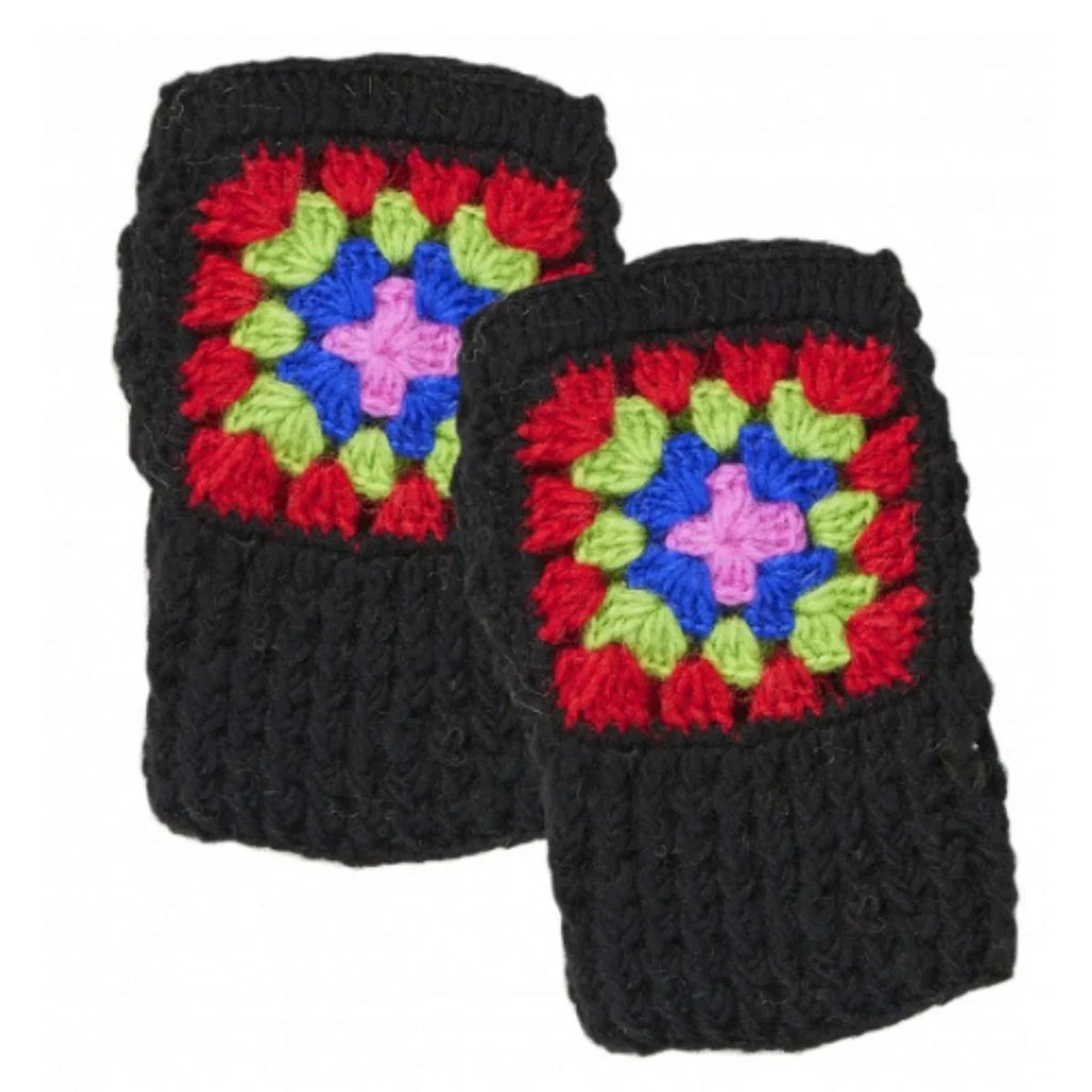 Pair of black knitted mittens with colorful square patterns on a white background