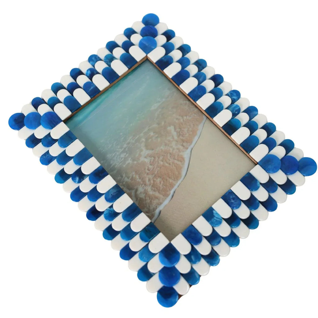 Square photo frame with blue and white pom-pom border on a white background