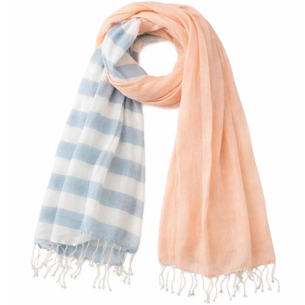 Two scarves, one striped blue and white, the other solid peach, on a white background.