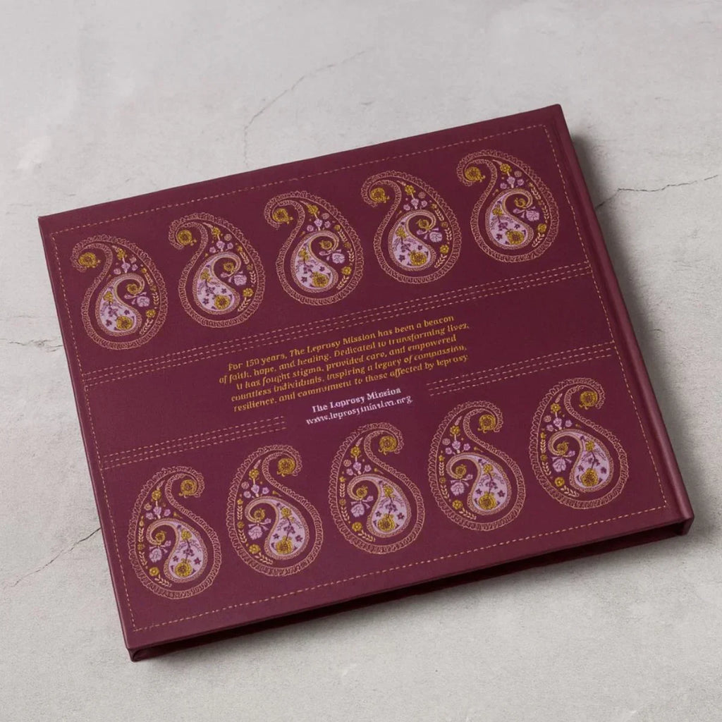 Decorative box with paisley patterns on a light gray surface