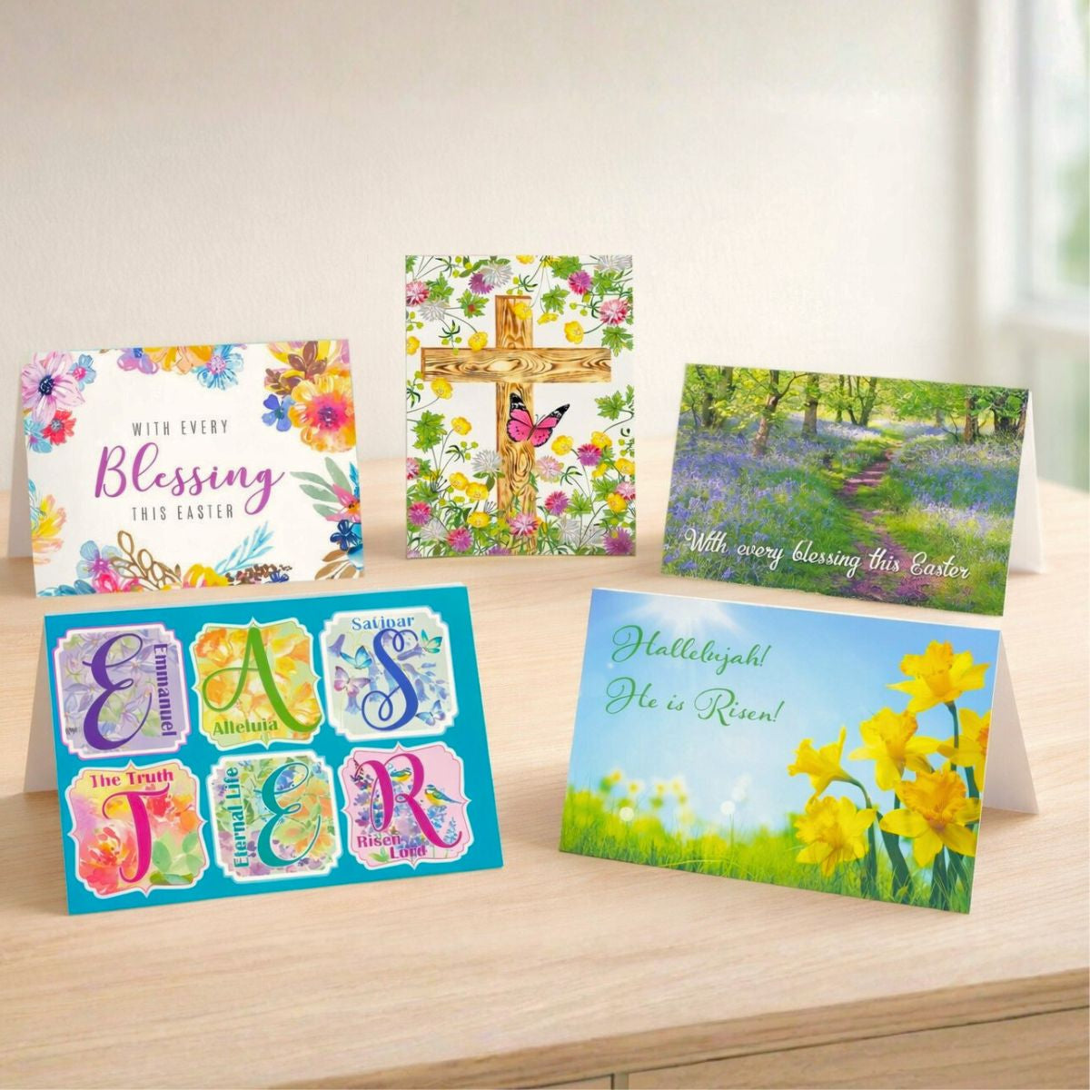 Collection of Easter greeting cards on a wooden surface with a light background