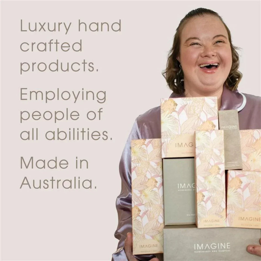 Person holding luxury handcrafted product boxes with text about employment and origin.