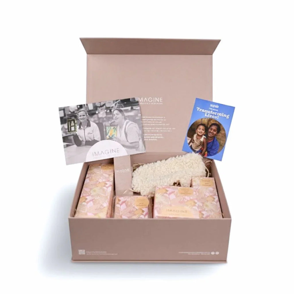 Gift box with decorative items and cards on a white background