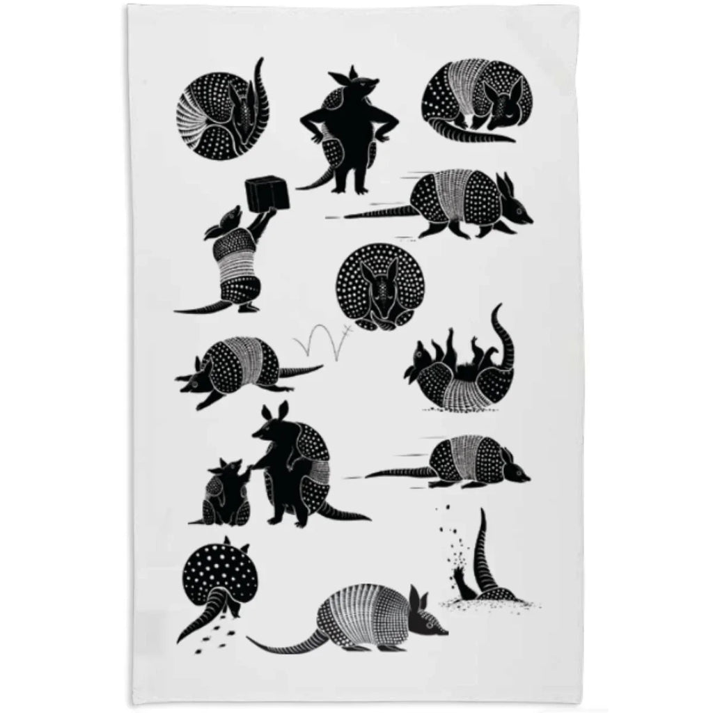 White towel with black armadillo illustrations