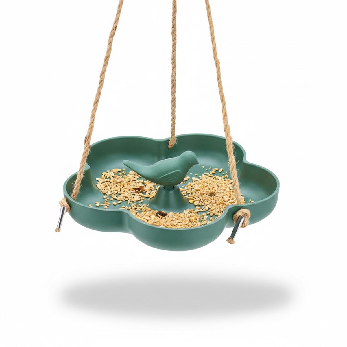 Green bird feeder with seeds and a bird figurine on a white background