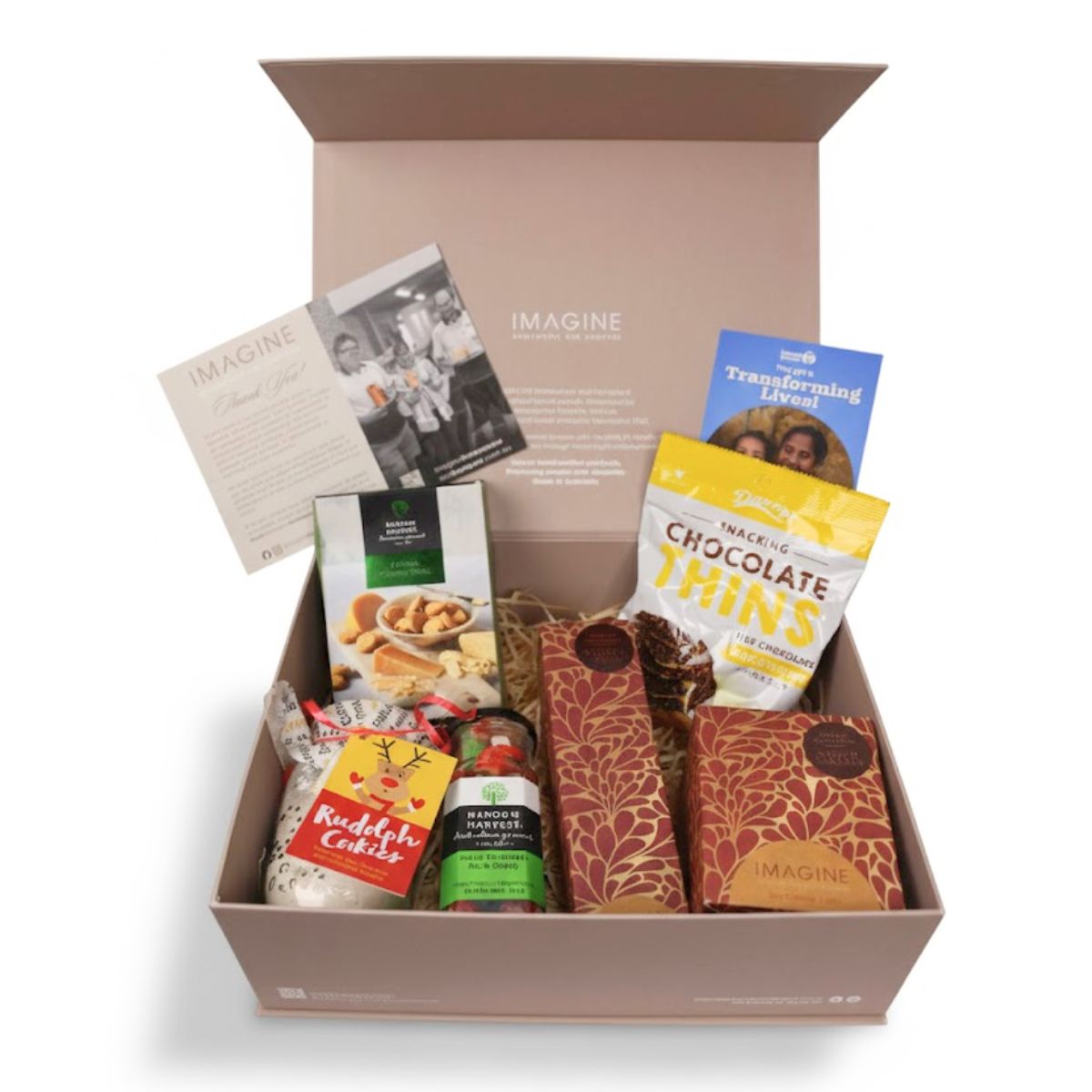 Gift box with various items including chocolate thins and cookies on a white background