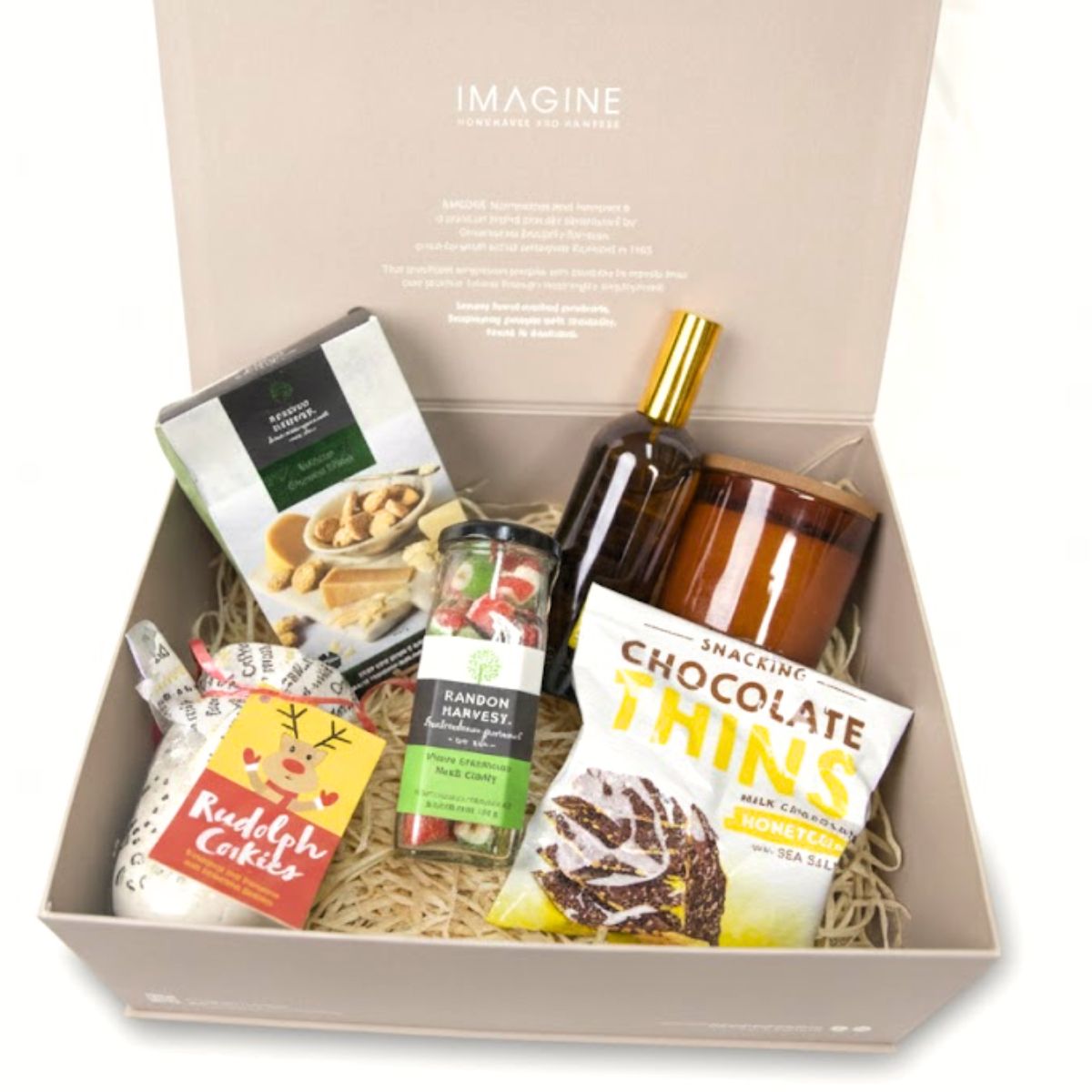 Gift box with assorted snacks and drinks on a white background