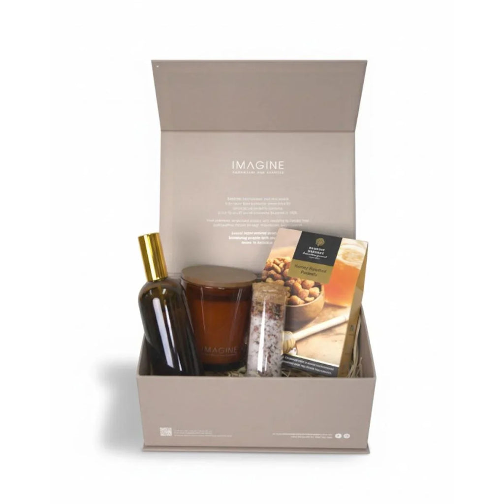 Gift box with cosmetic products and a magazine on a white background