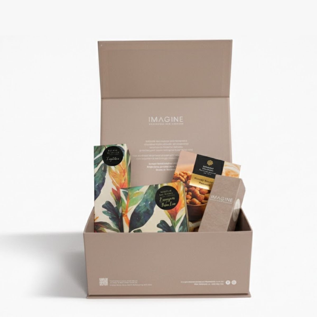 Open beige gift box with tea packages on a white background