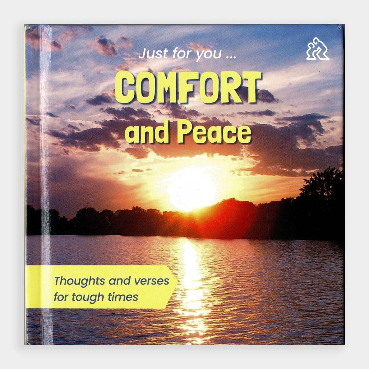 Book titled 'Comfort and Peace' with a sunset over water cover