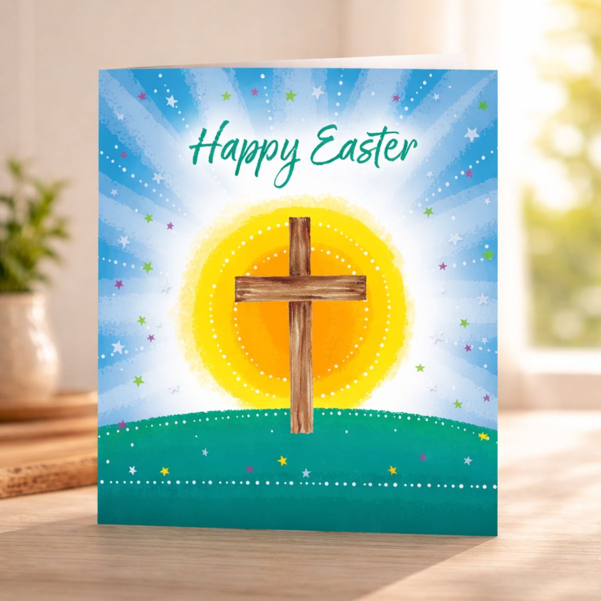 Easter card with a cross on a blue and green background