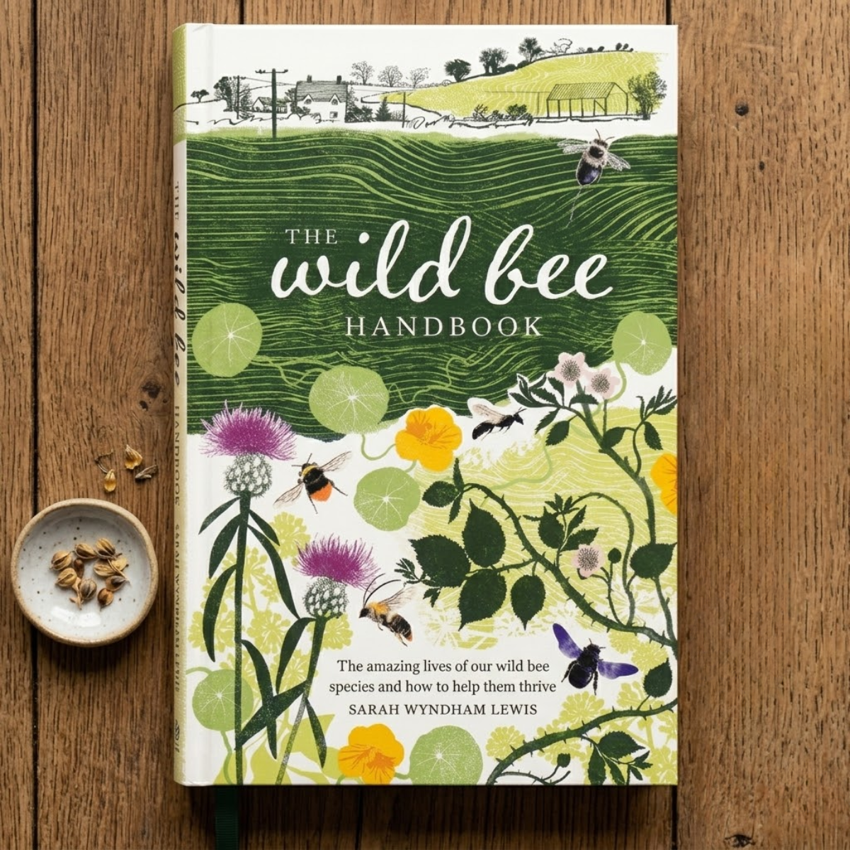 The wild bee handbook on a wooden table 