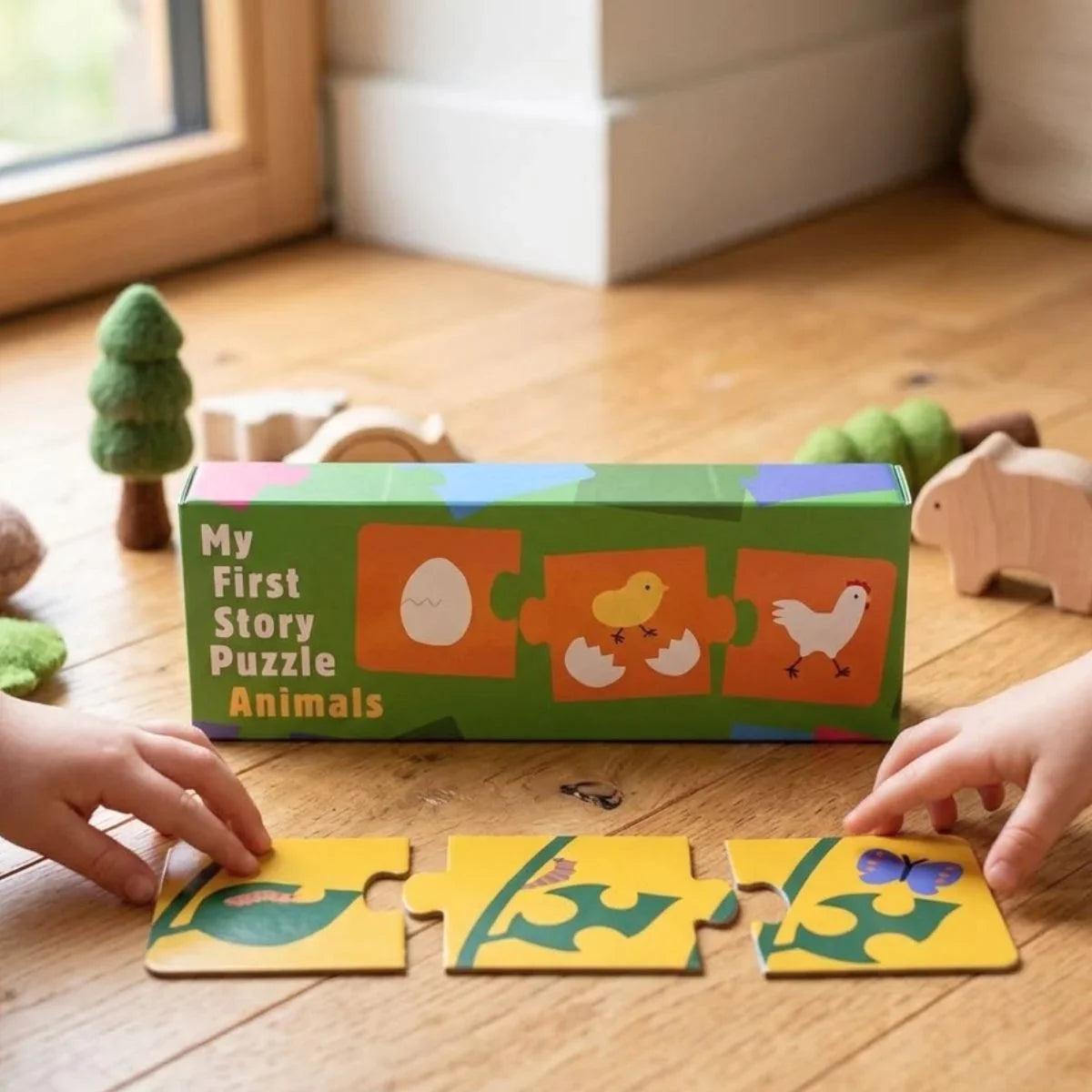 Children playing with a 'My First Story Puzzle Animals' toy on a wooden floor.