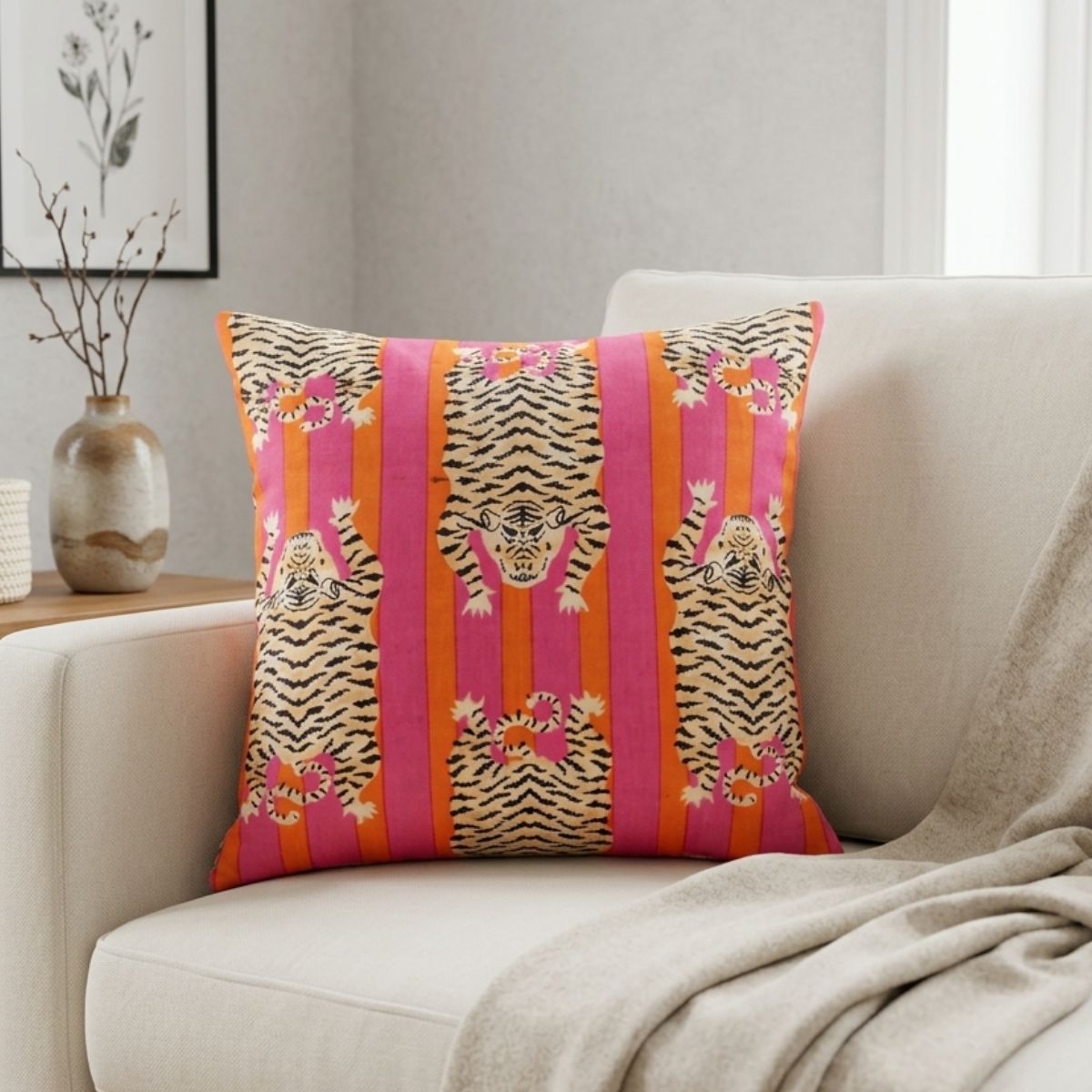 Decorative pillow with tiger pattern on a beige sofa