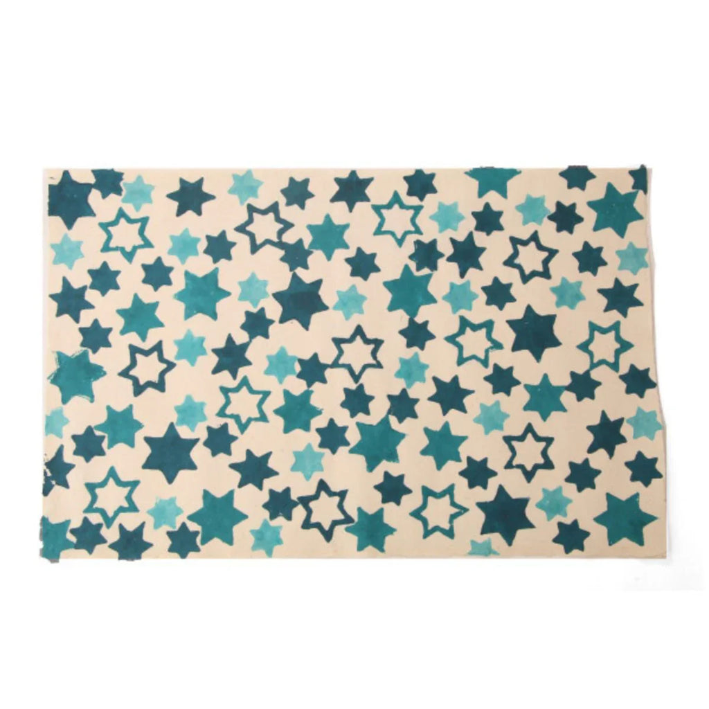 Patterned paper with star designs on a beige background