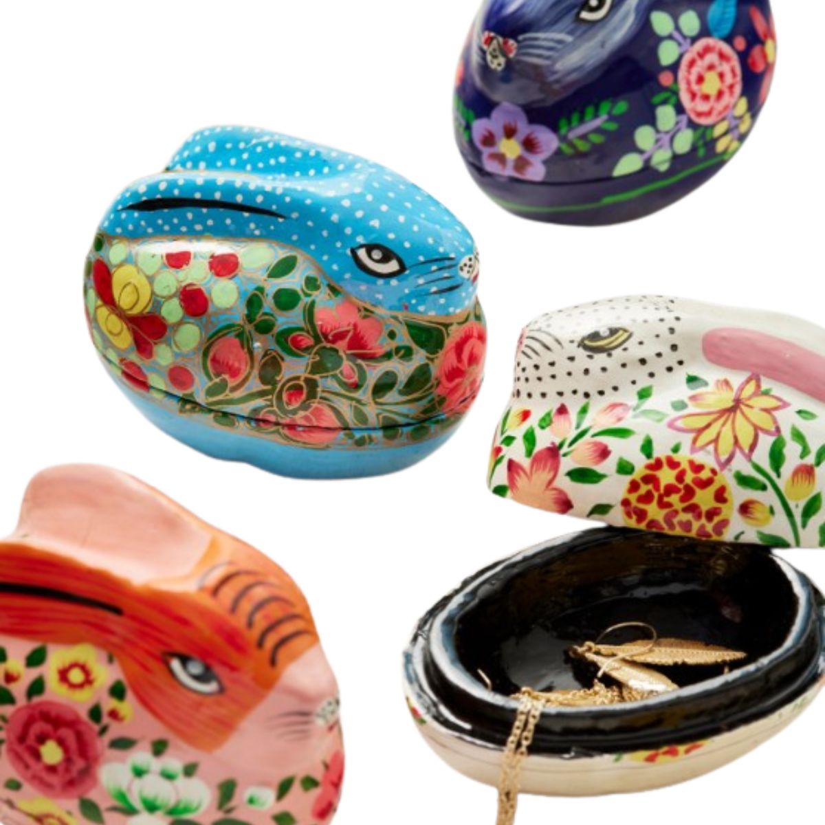 Colorful animal-shaped jewelry cases with floral designs on a white background