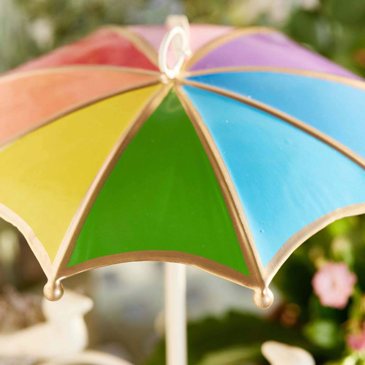 Colorful umbrella with a blurred natural background