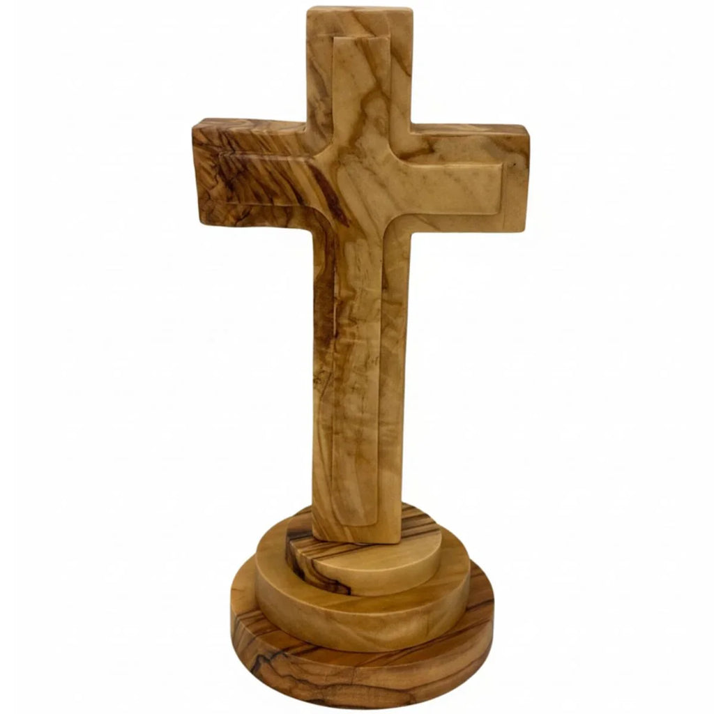 Wooden cross with a circular base on a white background