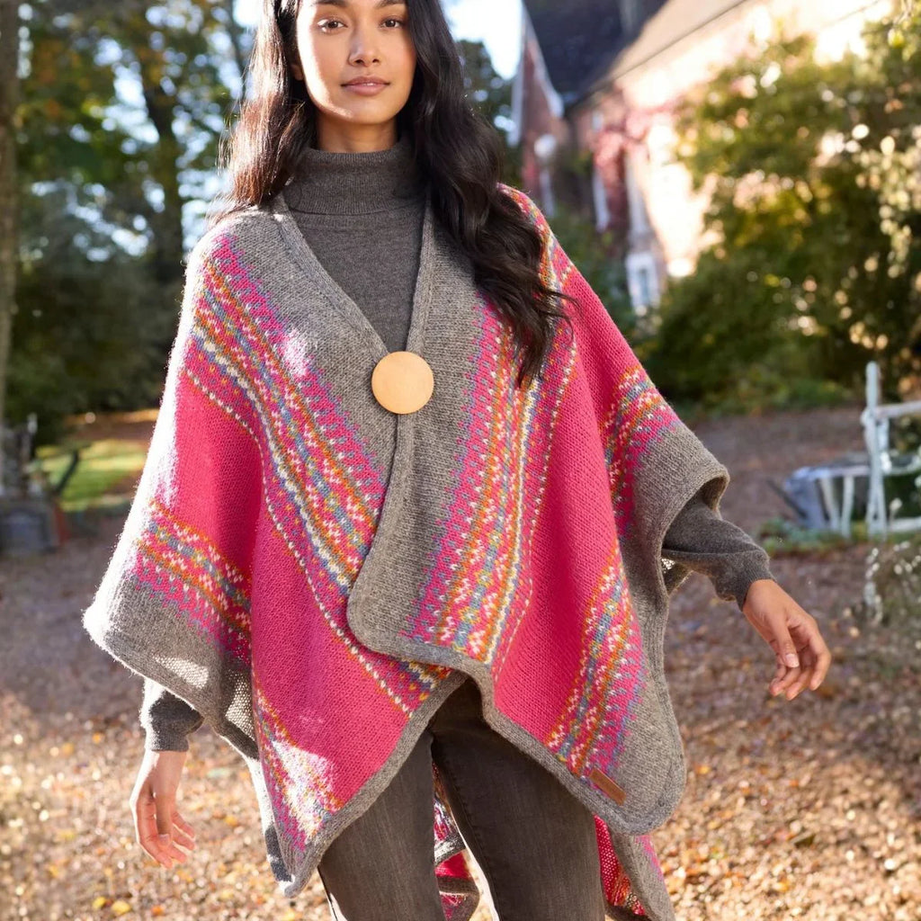 Woman wearing a colorful patterned poncho outdoors