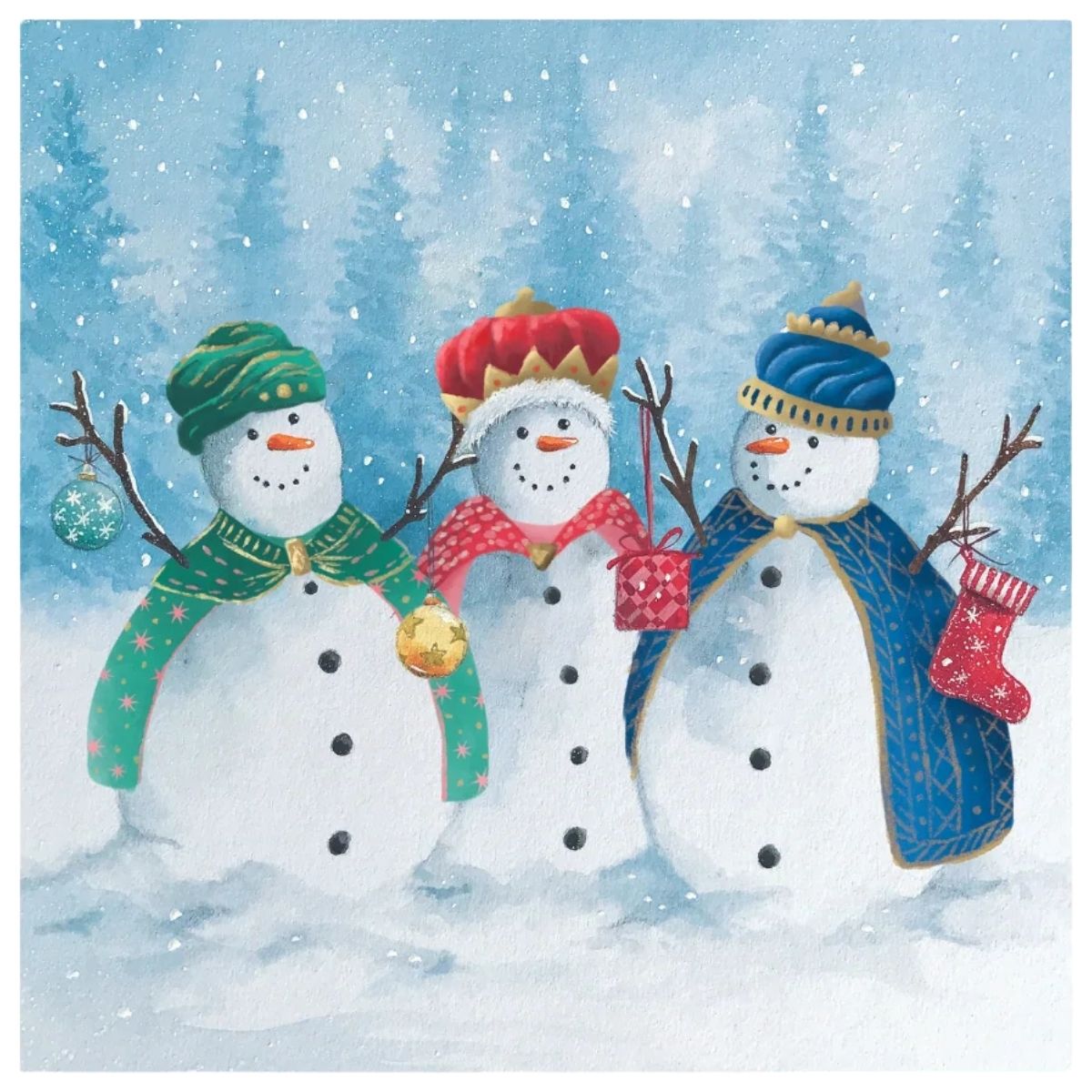 A festive winter illustration showing three snowmen standing in a snowy landscape with pine trees in the background. The snowmen wear colorful winter hats, scarves, and cloaks, and hold ornaments and a stocking.