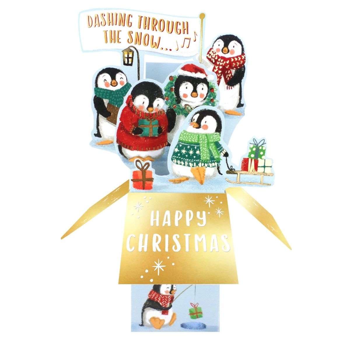A festive pop-up Christmas card featuring five penguins in colorful knit sweaters and scarves, with presents, a tree, and a sign reading 'Dashing Through The Snow.