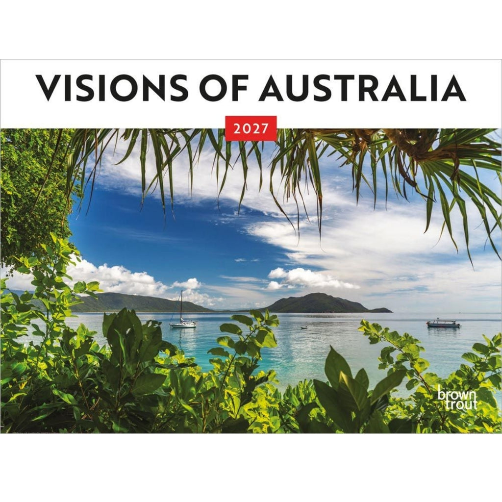 2027 'Visions of Australia' wall calendar cover featuring a tropical coastal landscape with palm leaves framing a blue sky, white clouds, turquoise water, and distant islands. The title 'VISIONS OF AUSTRALIA' appears across the top, with a small red '2027' box and the Brown Trout logo in the lower right.