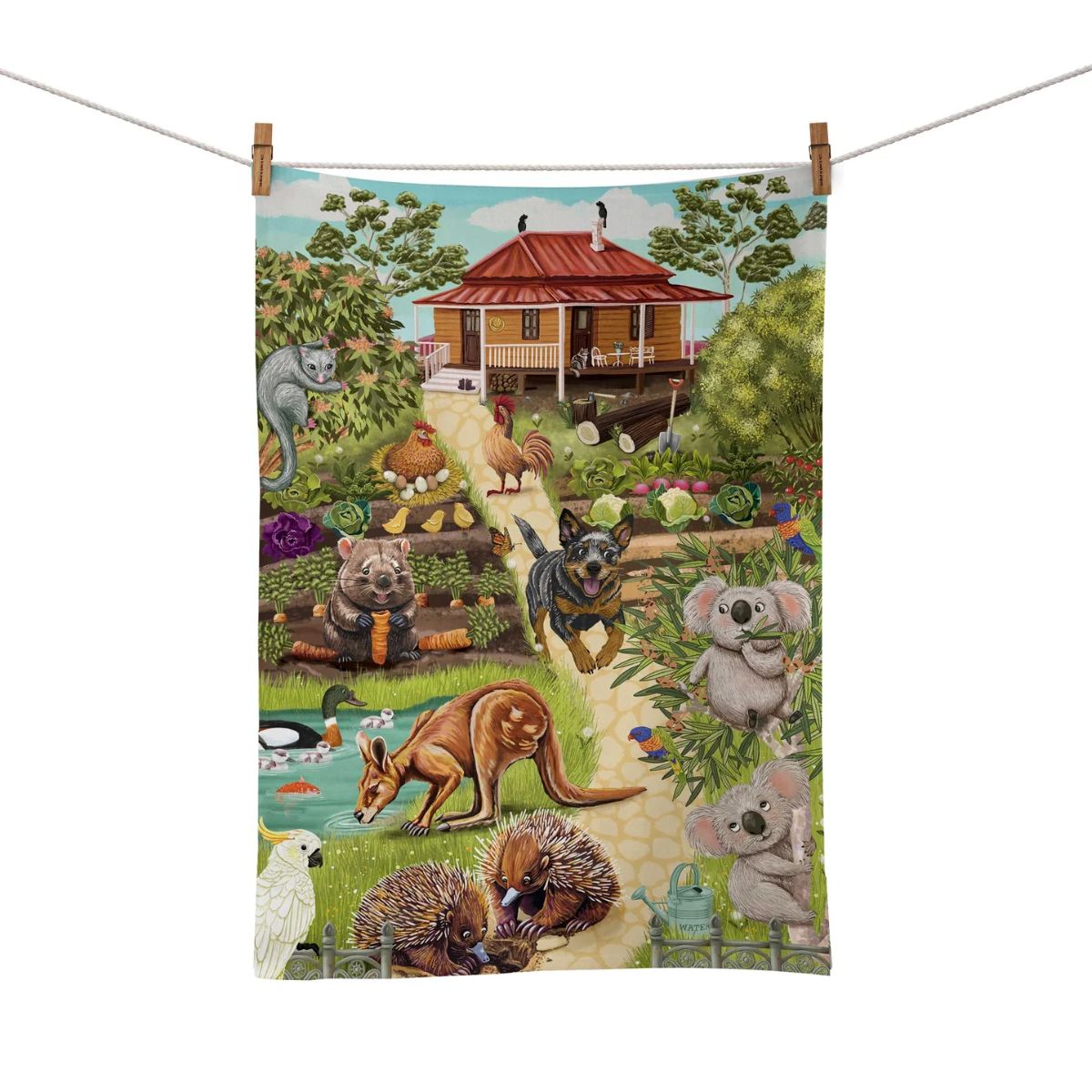 Tea towel with a colorful design of Australian animals and a house in a garden.