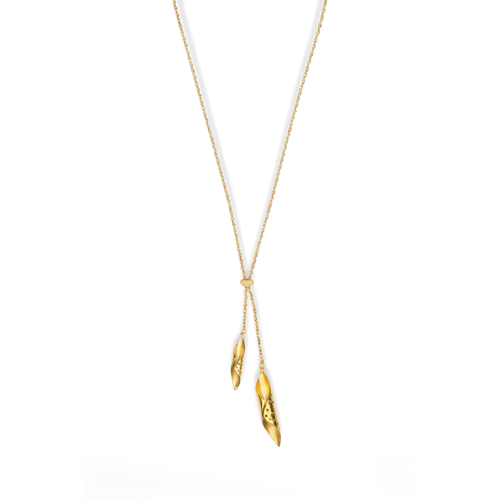 Gold necklace with pendant on a white background