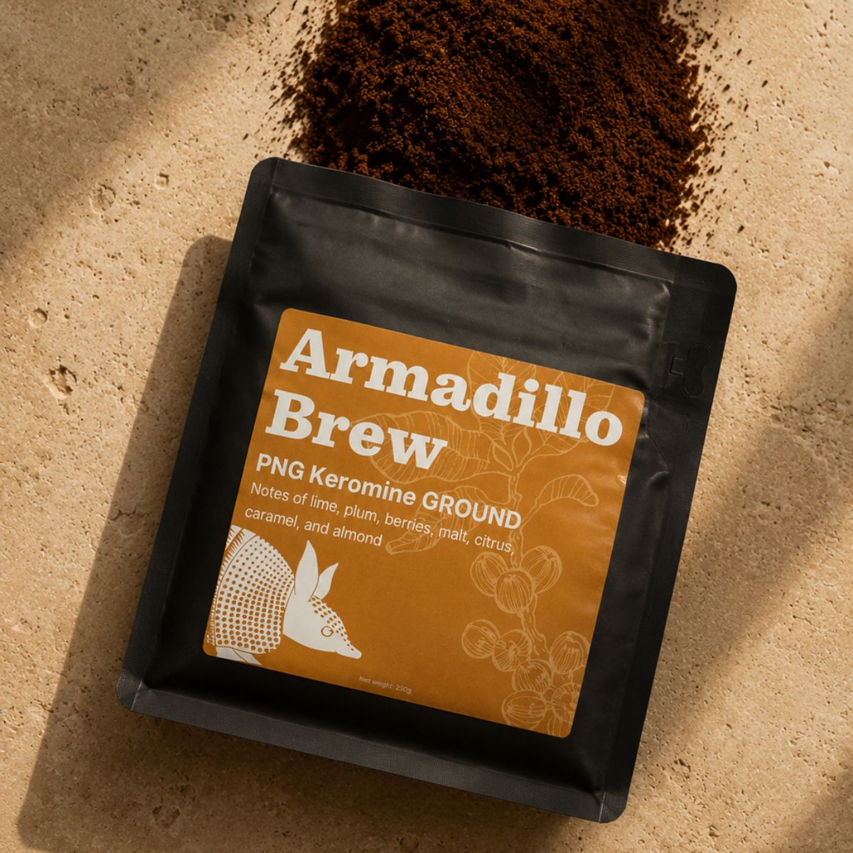 Coffee package labeled 'Armadillo Brew' with coffee grounds on a beige background