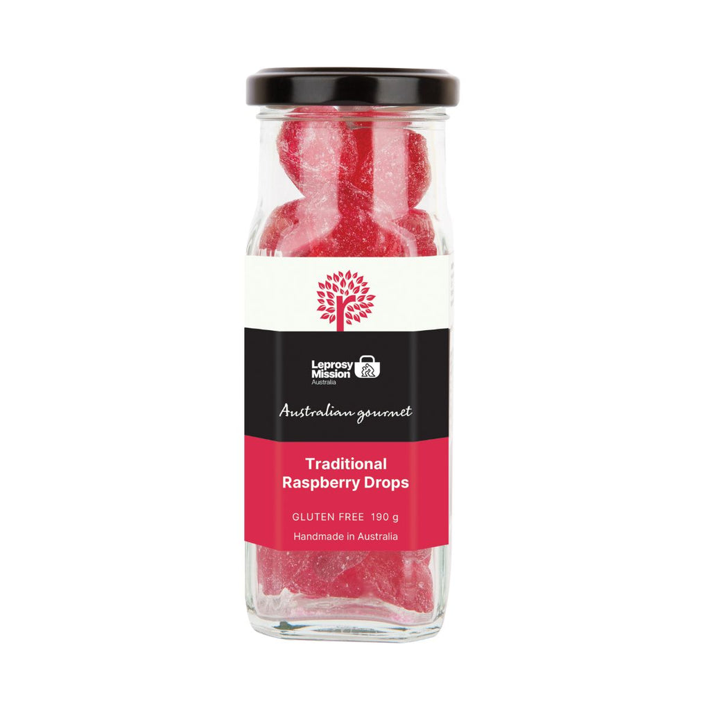 Jar of traditional raspberry drops with a visible brand label on a white background