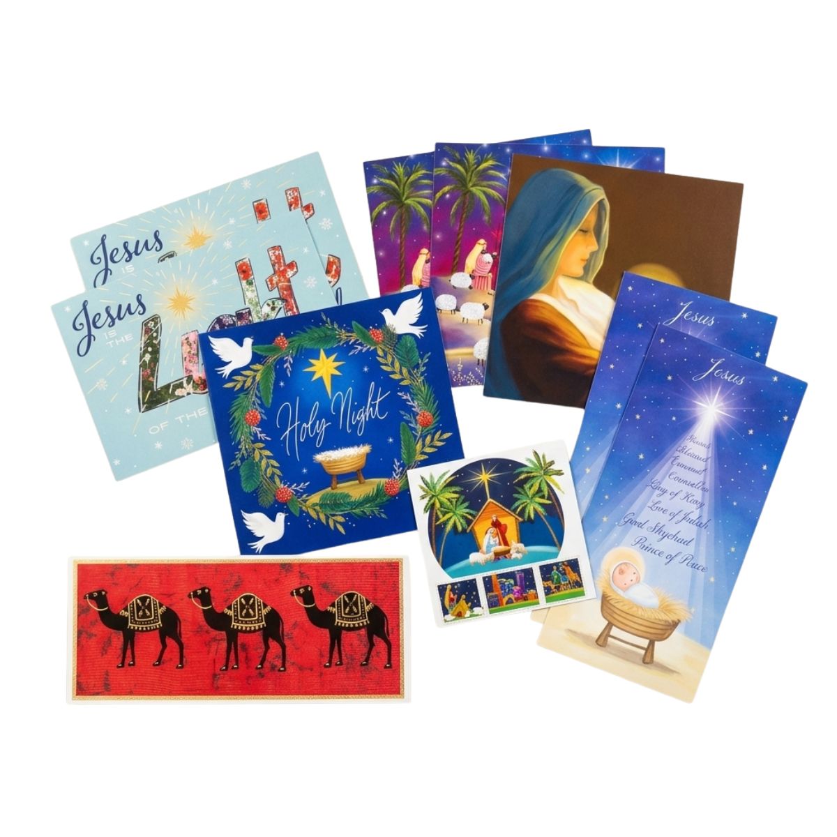 A set of Christmas and Nativity-themed art prints and cards arranged on a plain white background. The designs include blue starry night scenes with a baby in a cradle, a nativity scene with palm trees, a red background with camels, white doves, and a portrait of Mary.