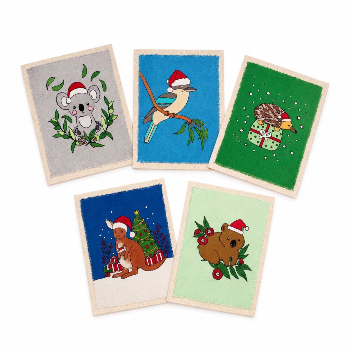 Five small rectangular fabric art cards with rough-cut edges, each showing a different animal wearing a Santa hat: a gray kangaroo, a blue jay, a green hedgehog, a brown kangaroo, and a red kangaroo, arranged on a white background.