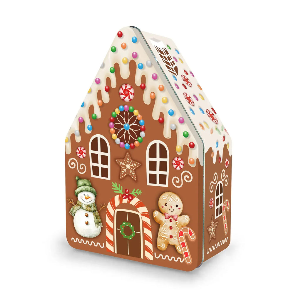 A gingerbread house shaped tin or box decorated with white icing-like drips, colorful candy sprinkles, a candy cane arch, a snowman, a gingerbread person, and holiday details, shown on a light gray background.