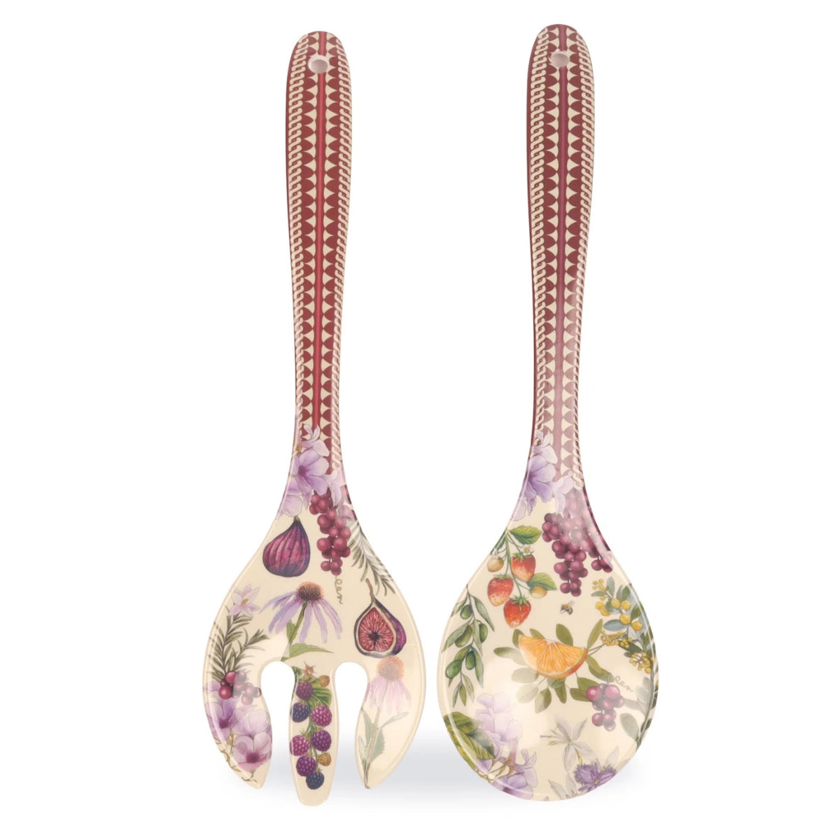 Two decorative serving utensils with long handles and broad flat heads, shown on a plain white background. The utensils have a cream base with botanical illustrations including figs, grapes, strawberries, and purple flowers, plus a reddish-brown geometric pattern near the top of each handle.
