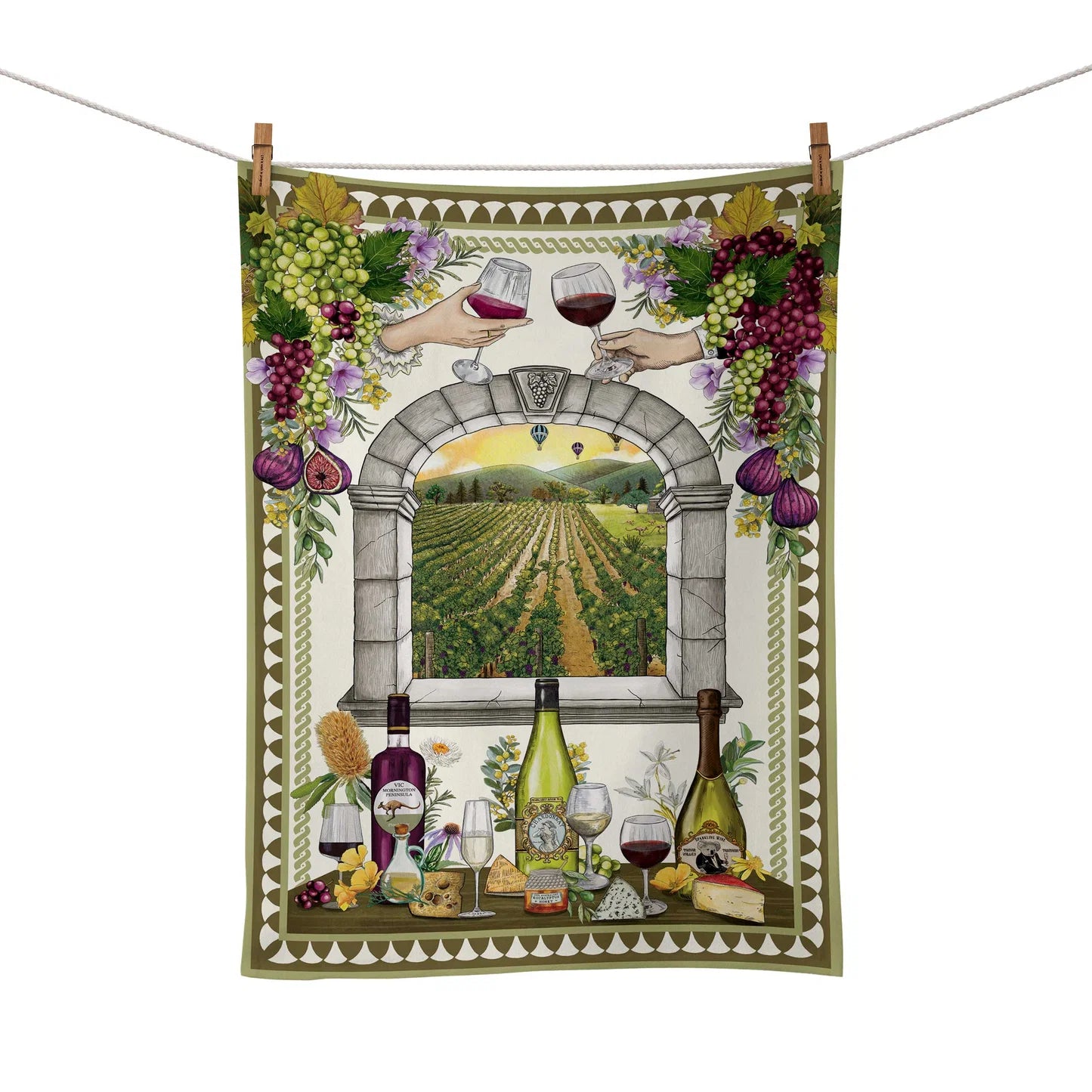 Decorative towel with wine-themed design featuring bottles, grapes, and a vineyard view.