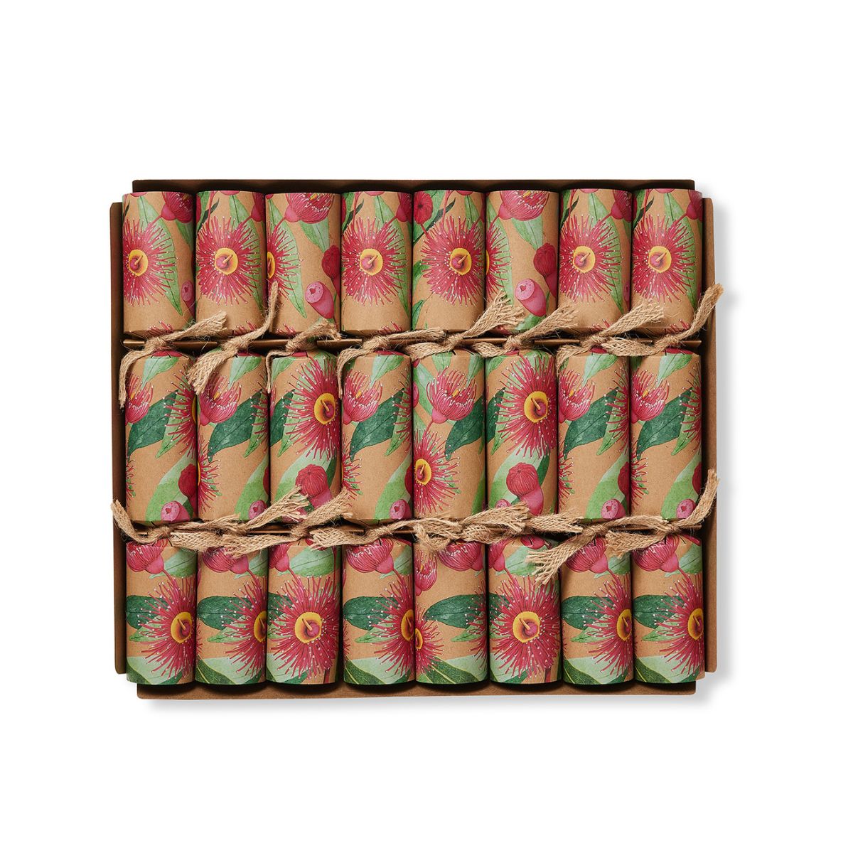 A boxed set of 18 wrapped crackers or fire crackers arranged in a 3x6 grid inside a brown cardboard box. Each wrapper has a vintage-style floral print with pink flowers, green leaves, and red berries on a tan background, tied with thin twine.