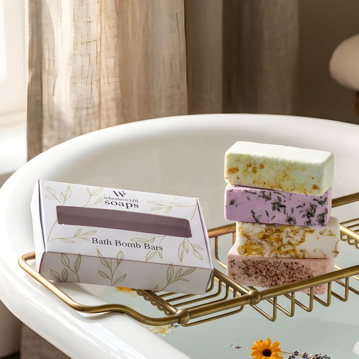 Stack of bath bomb bars on a gold tray with a box labeled 'Wishes & Wonders Soaps' in a bathroom setting.