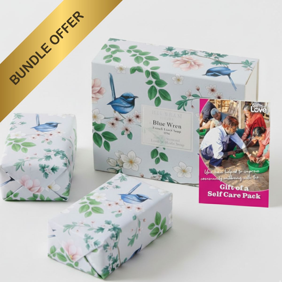 Floral-patterned gift boxes with a 'Blue Wren' soap and a 'Gift of a Self Care Pack' leaflet on a white background.