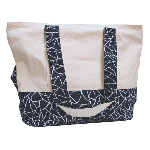 Beige tote bag with black geometric pattern on handles and base