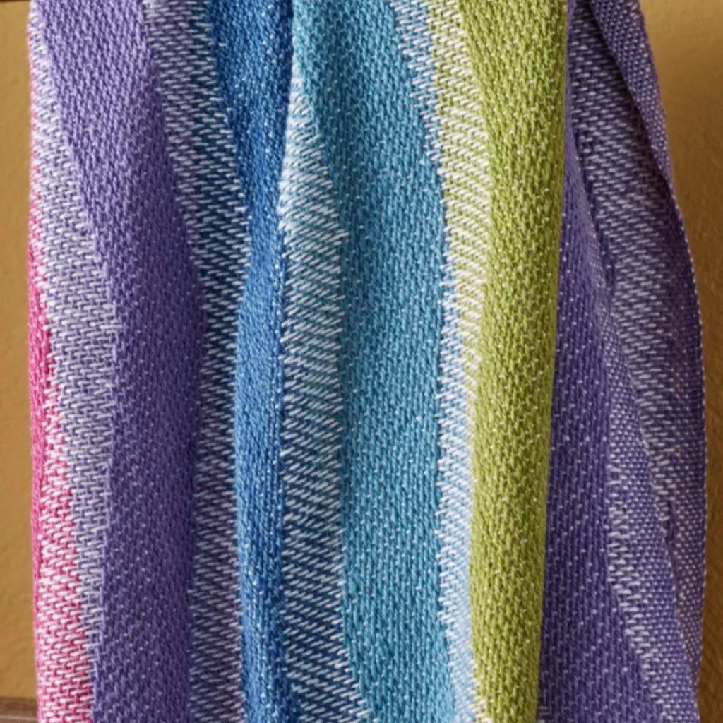 Close-up of a multicolored striped fabric with shades of purple, blue, green, and pink.